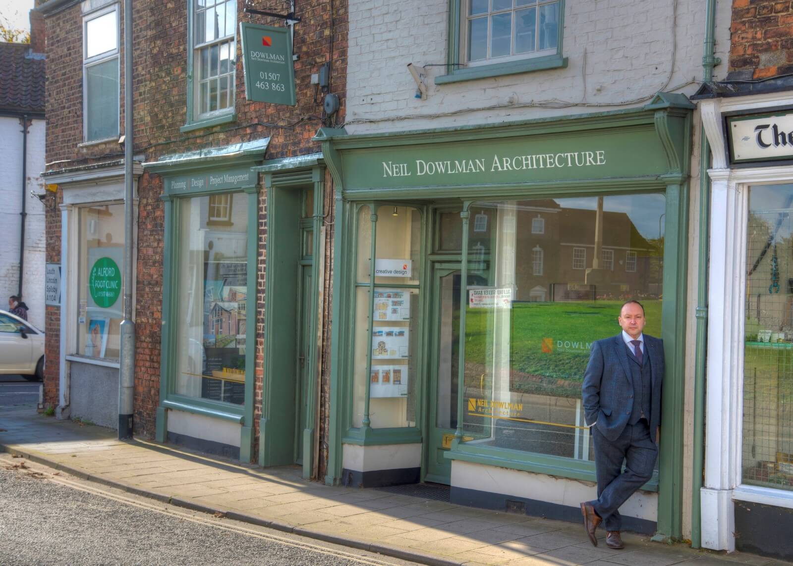 man stood outside building